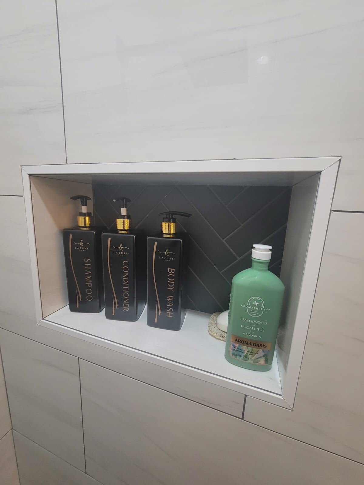 Walk-in shower with encaustic tile floor and navy vanity