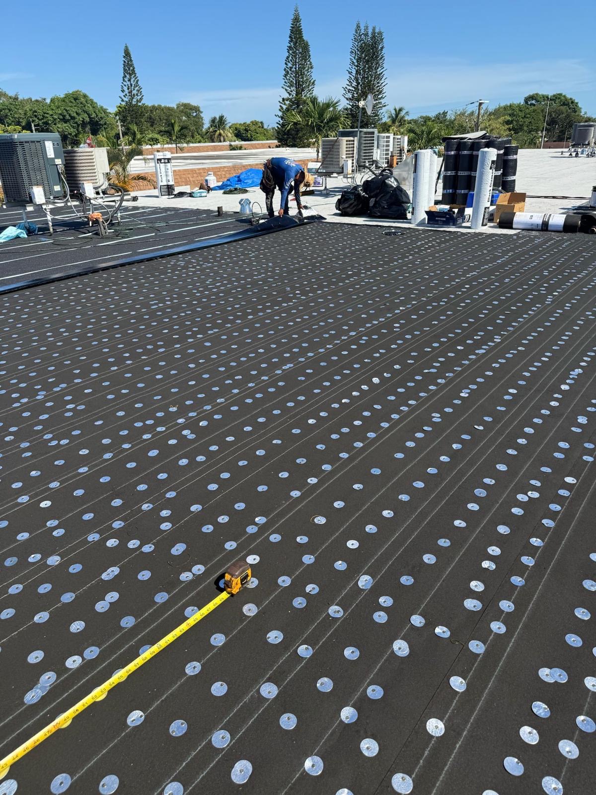 Flat roof membrane installation
