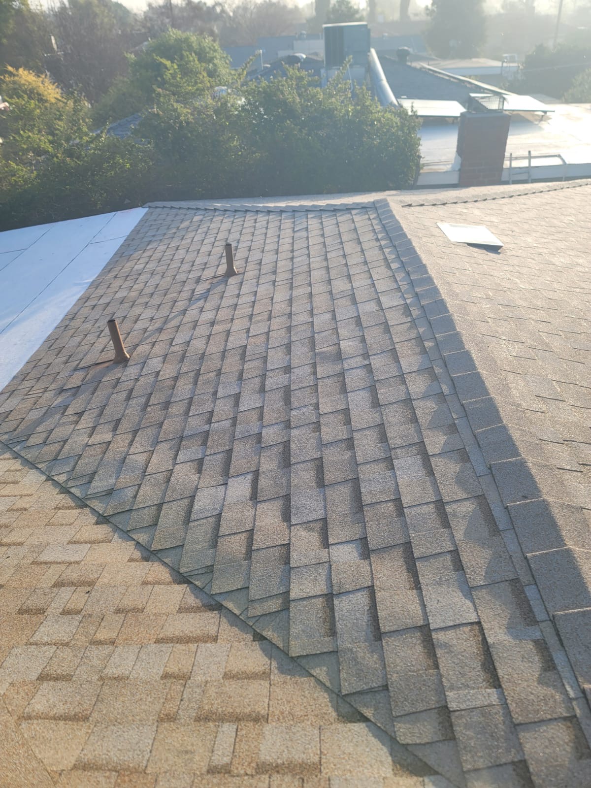Spanish tile roof repair on stucco home