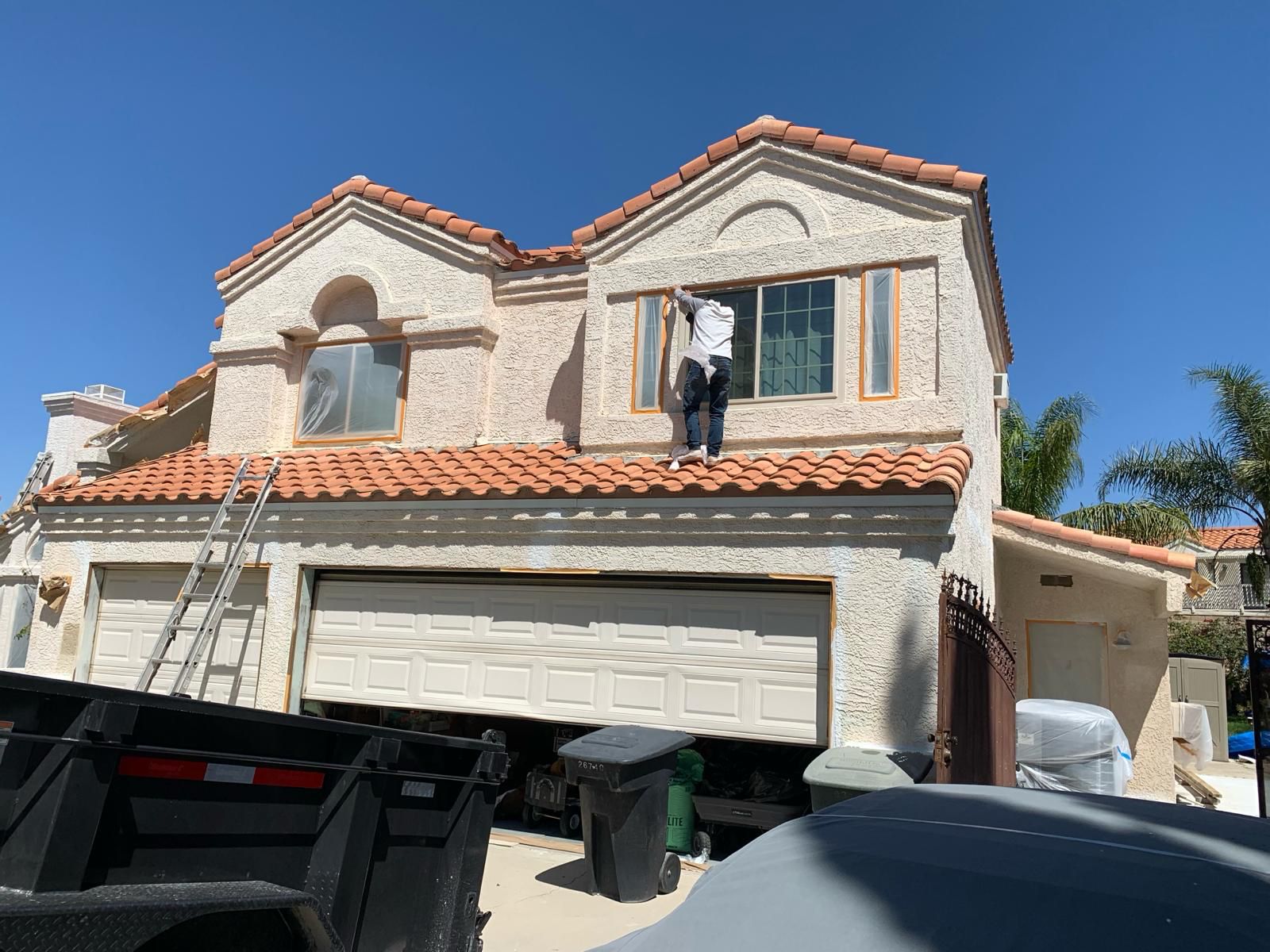 Standing seam metal roof installation luxury home